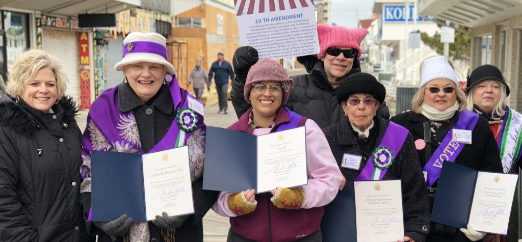 Left to right are Melissa Kelly, Representing Senator Chris Van Hollen, followed by March Organizers Susan Buyer, Indivisible Worcester; Rosie Bean, FLIP; Toby Perkins, Indivisible Worcester; Linda Linzey, The Suffrage Centennial Celebration Committee; Vicky Wallace, The Democratic Women’s
Club of Worcester County; Debbie Gousha, The Suffrage Centennial Celebration Committee